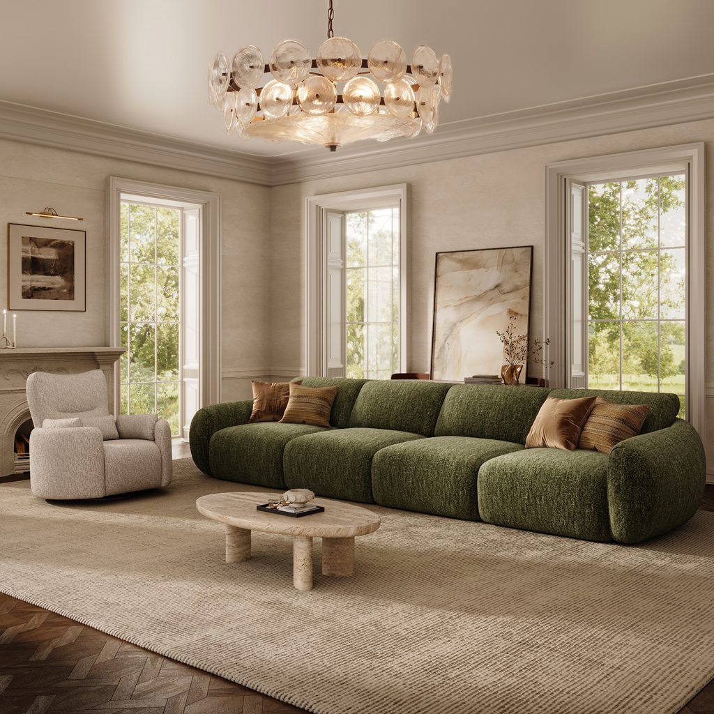 Oversized green four-seat sofa with wide cushions in a spacious modern living room.