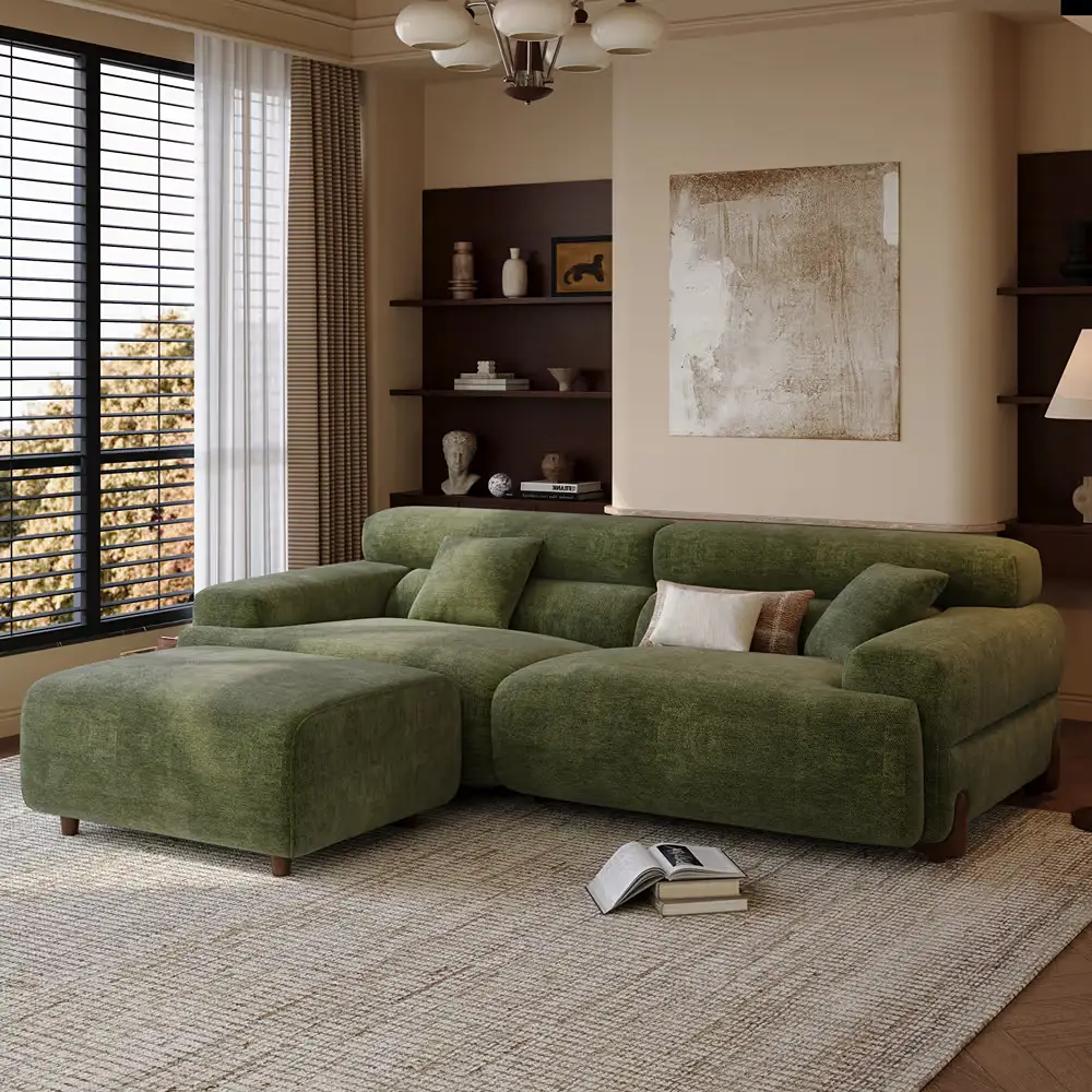 Green modular sofa with matching ottoman positioned as a footrest in a living room.