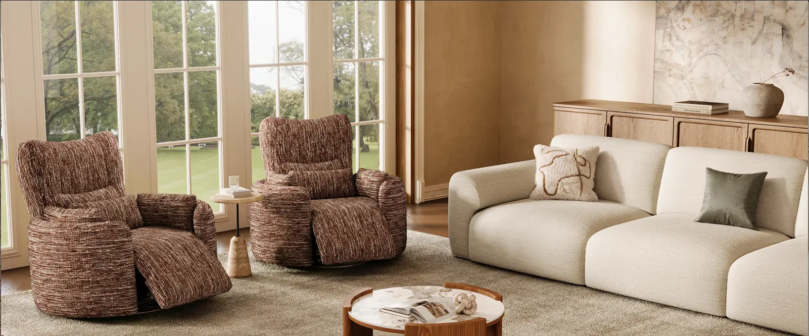 Cozy modern living room with two brown recliner chairs, a cream sleeper sofa, and large windows.