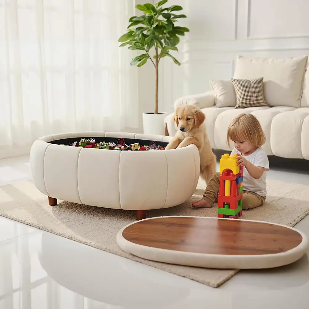 Cream round storage ottoman filled with toys beside a child and dog in a bright living room.
