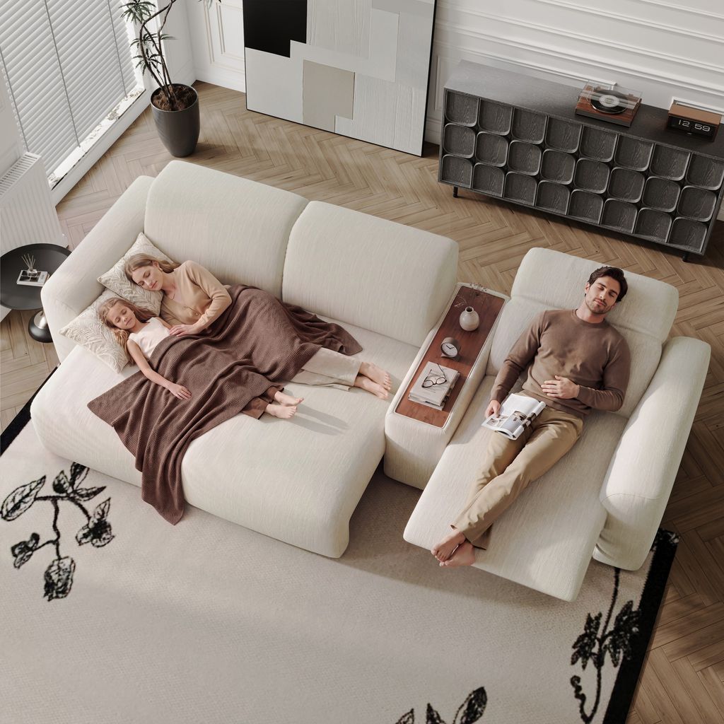 Family relaxing and sleeping on a large white sectional sofa in a modern living room.