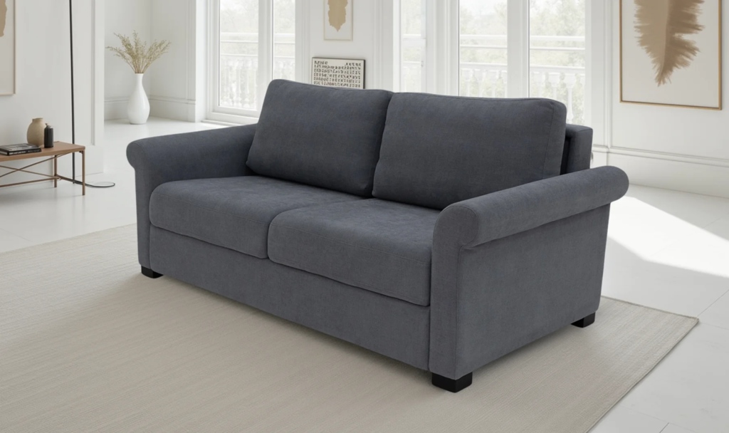 Dark gray wall-hugger sleeper sofa in a bright contemporary living room with large windows and neutral decor.