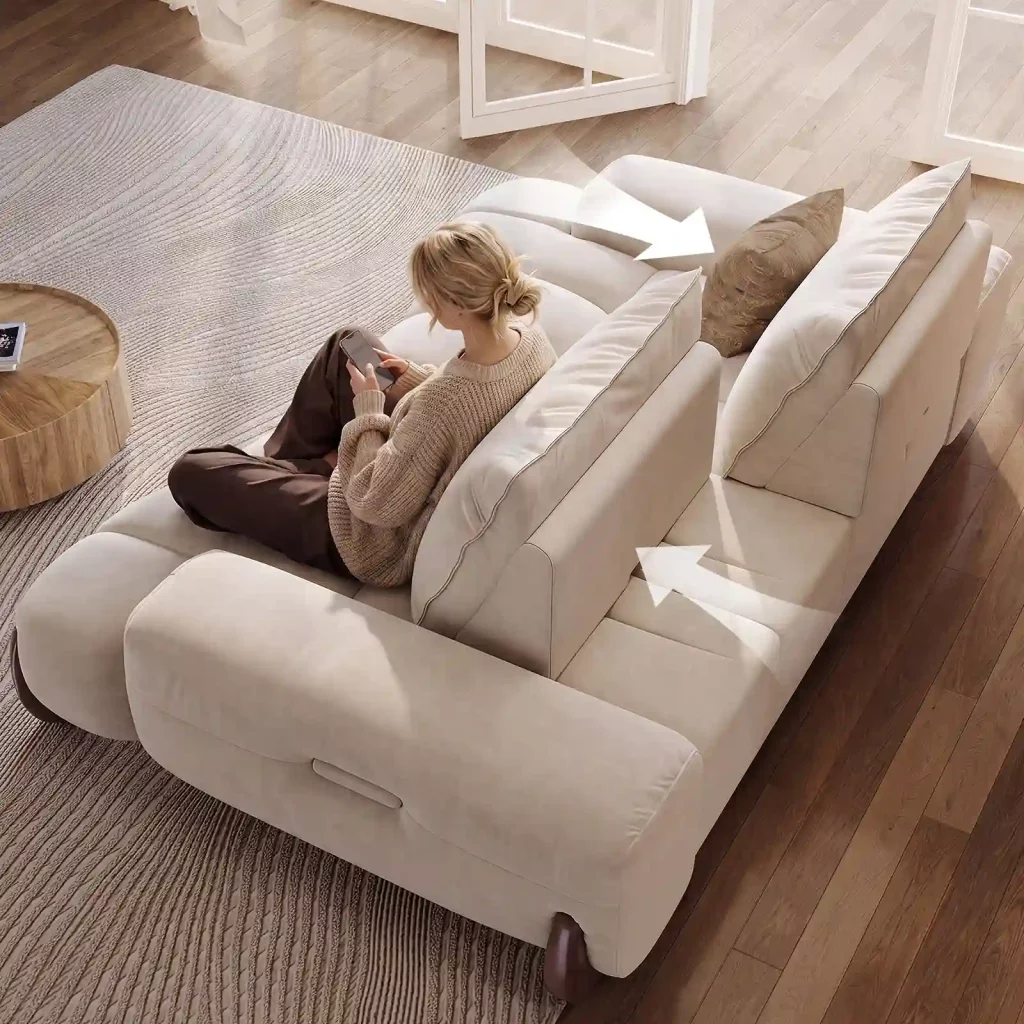 Woman sitting on a cream sofa with adjustable back cushions, using her phone in a bright living room, with arrows showing the movable backrest positions.