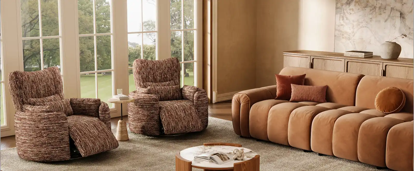 Two brown textured reclining armchairs with extended footrests beside a tan upholstered sofa in a sunlit living room with large windows.