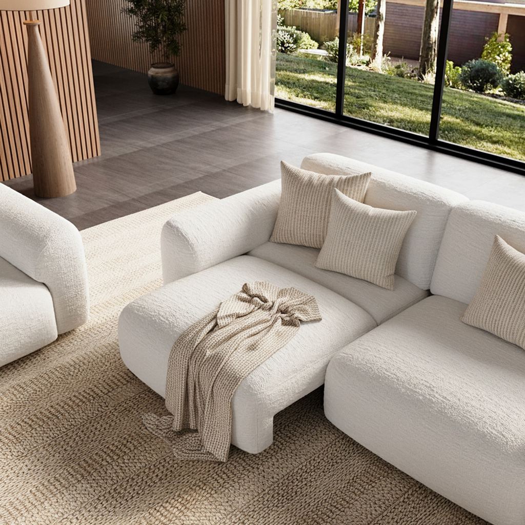 Neutral modular sectional sofa with chaise in a bright, family-friendly living room.