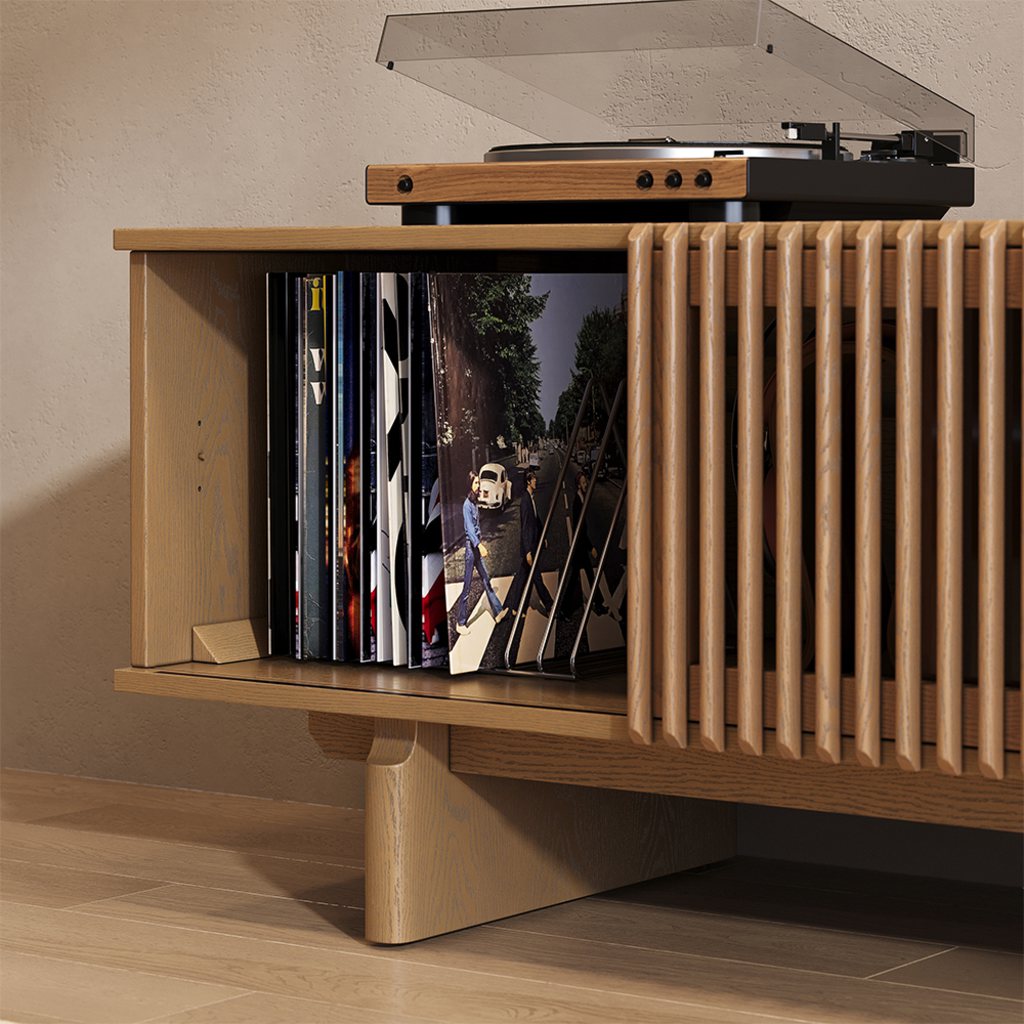 Wooden record player stand with a turntable on top, built-in vinyl record storage, and a slatted cabinet design for a home music listening room.