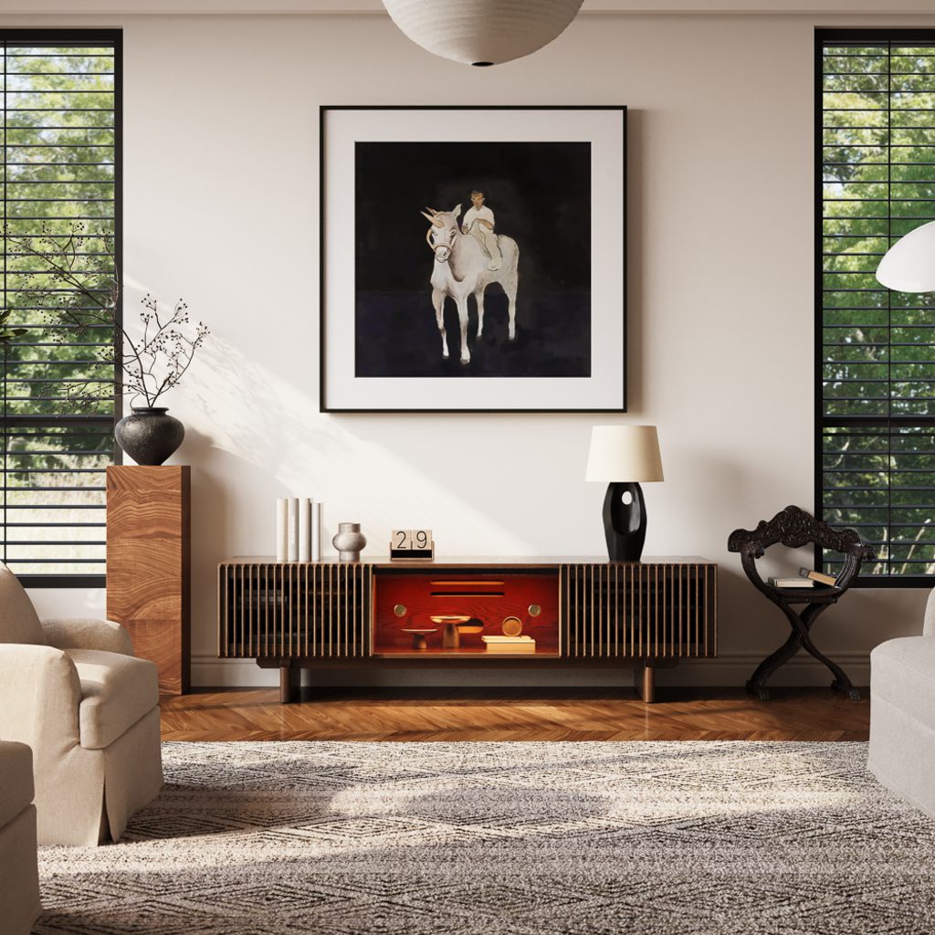 Earthy living room with a walnut TV stand, cream armchairs, a textured neutral rug, warm white walls, and natural greenery.