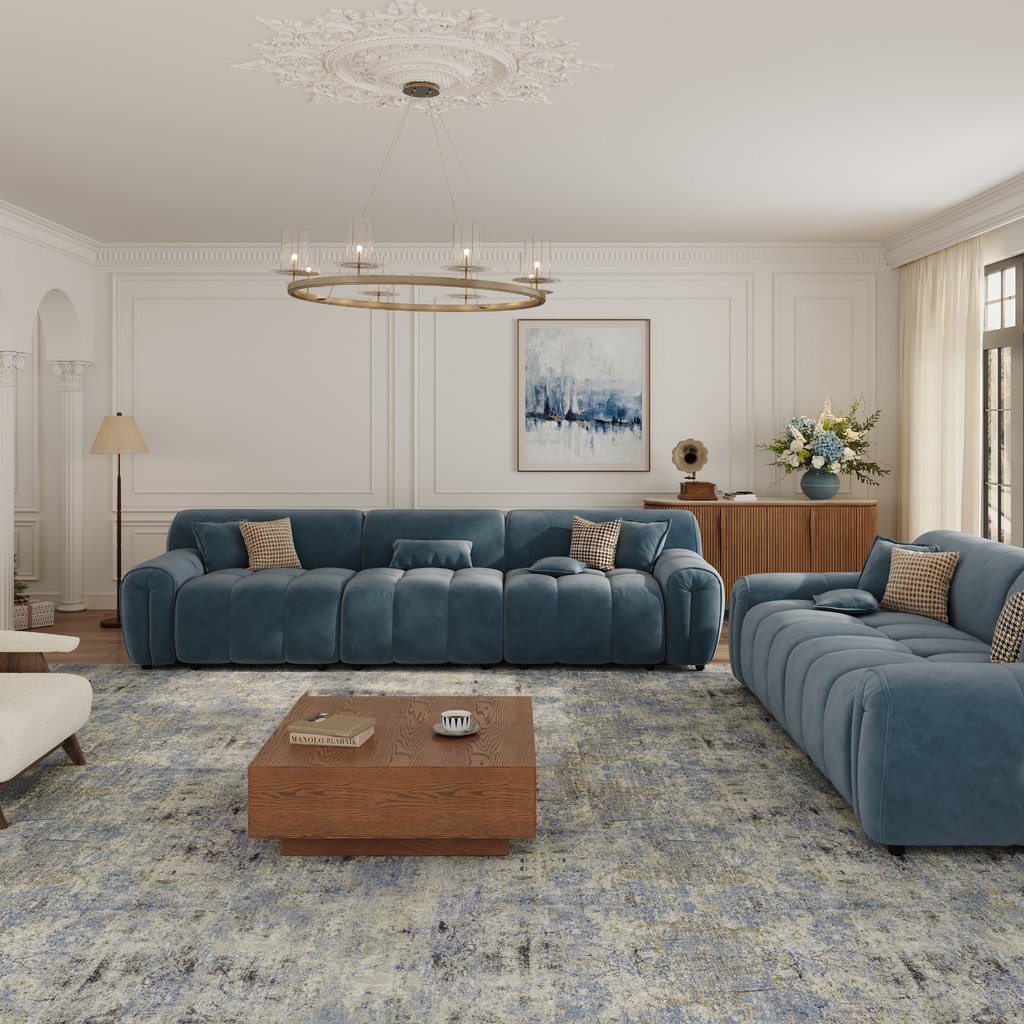 Two blue upholstered sofas arranged in an L-shaped seating layout around a wooden coffee table in an elegant living room.