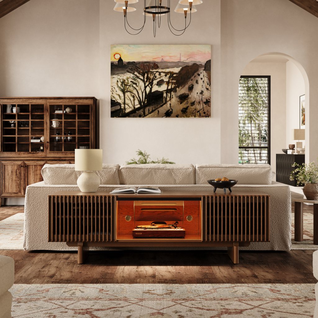Modern family living room with a cream sofa, fluted wood TV console, vintage record player, wooden cabinet, artwork, and warm neutral decor.