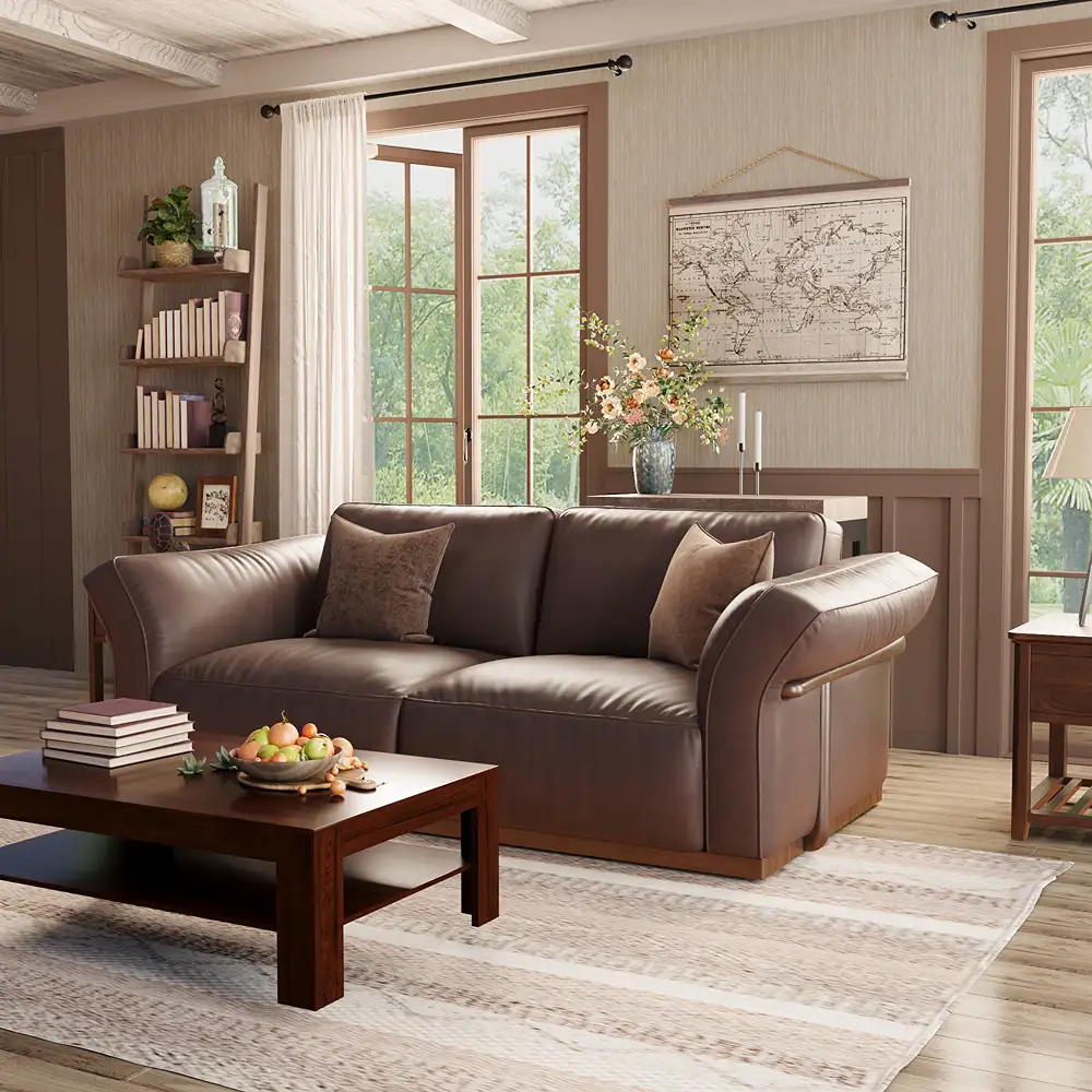 Deep seat dark brown leather sofa with wide armrests and plush back cushions in a bright, traditional living room.